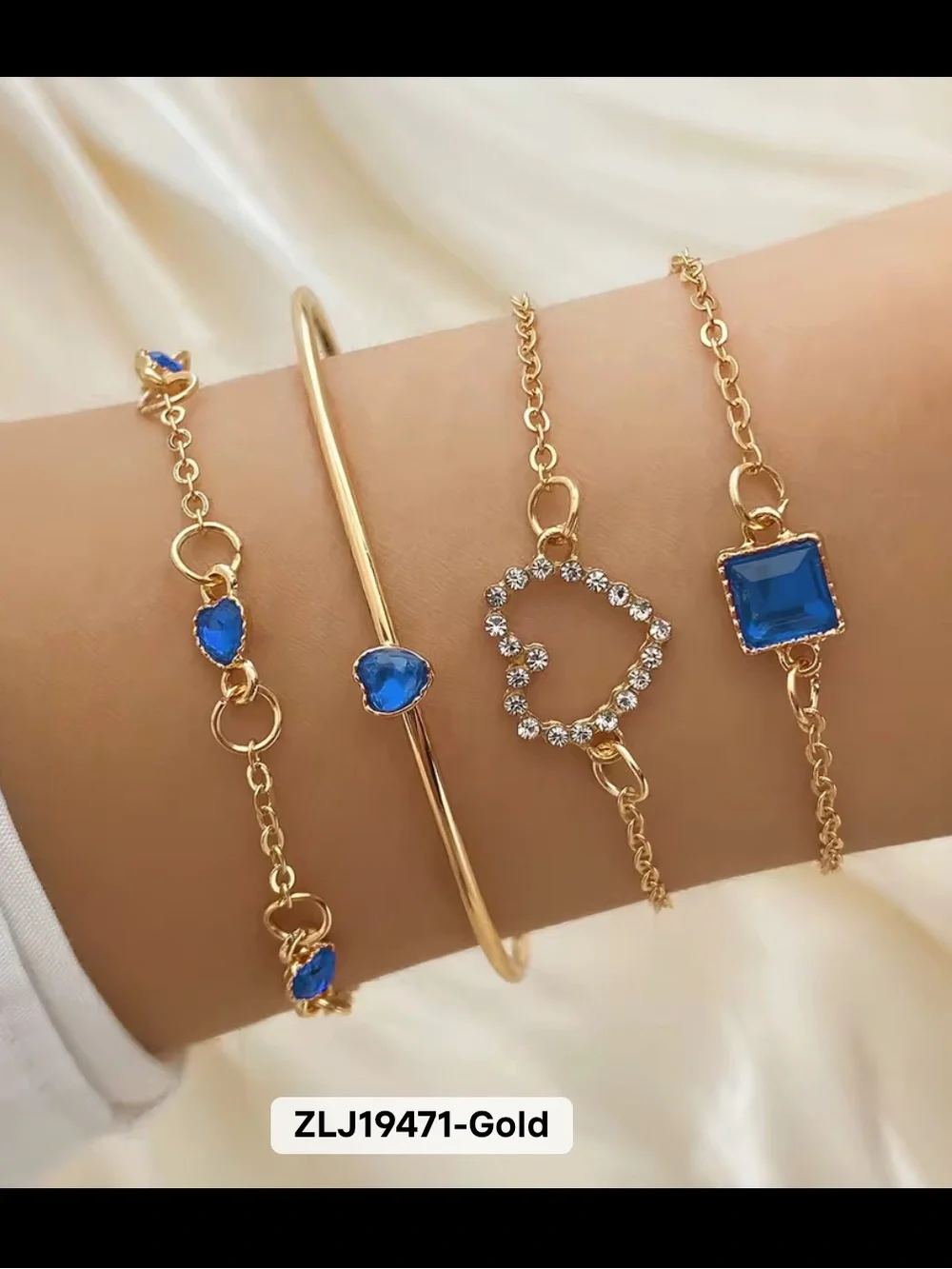 Gold Bracelet Set with Blue Gem Accents by